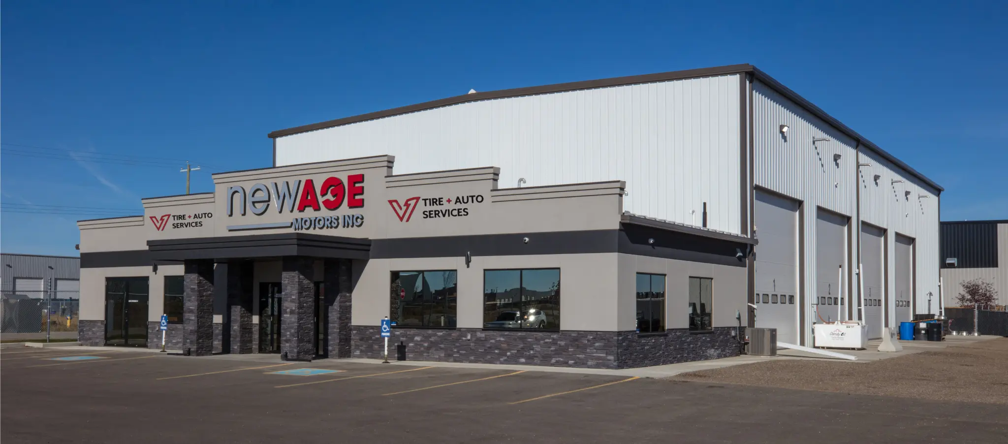 New Age Motors V1 building at night